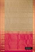 Beige Dual Tone Kanchipuram Silk Saree with Zari Butta on the body and Zari Border.  displayed on a mannequin