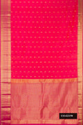 Coral Dual Tone Kanchipuram Silk Saree with Zari Butta on the body and Zari Border.  displayed on a mannequin