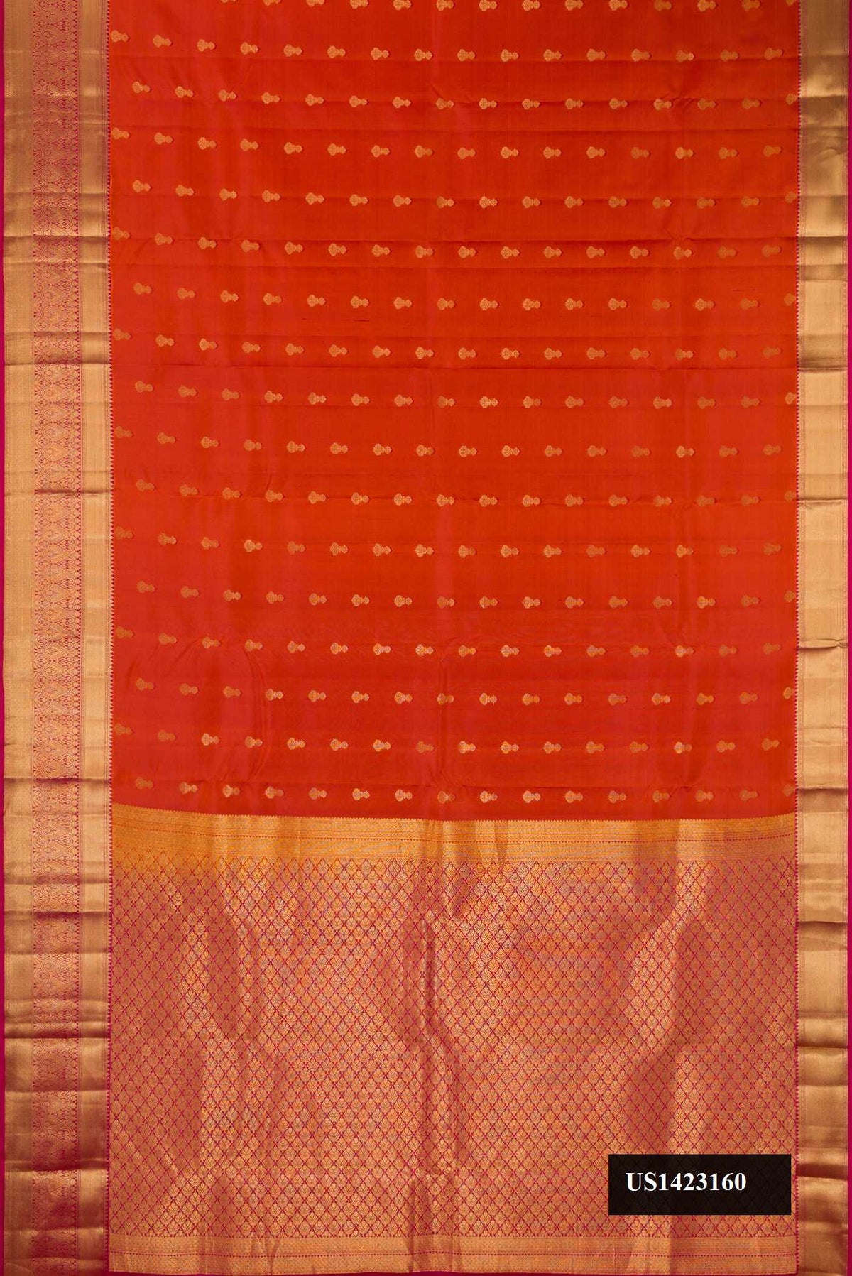 Rust Dual Tone Kanchipuram Silk Saree with Zari Butta on the body and Zari Border.  displayed on a mannequin