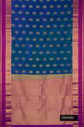 Peacock Blue Dual Tone Kanchipuram Silk Saree with Zari Butta on the body and Zari Border.  displayed on a mannequin