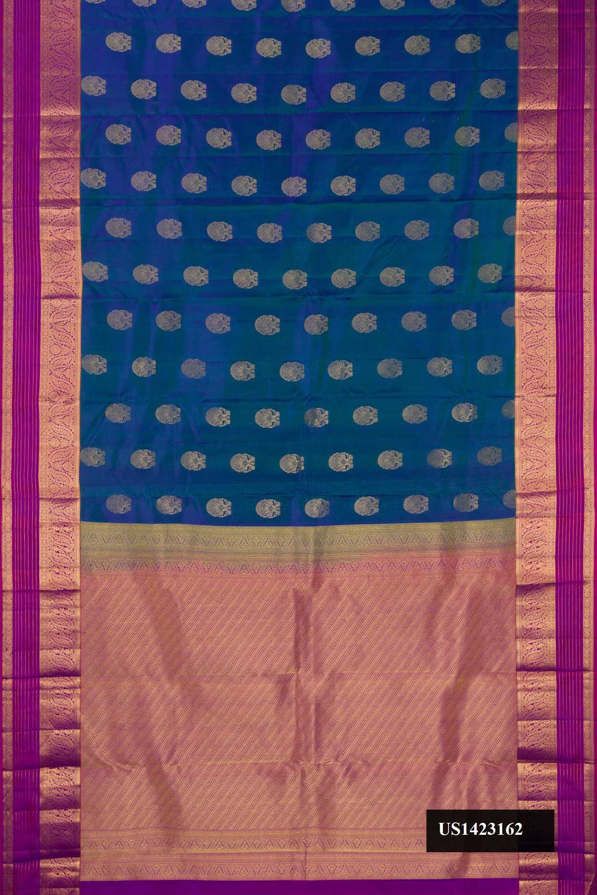 Peacock Blue Dual Tone Kanchipuram Silk Saree with Zari Butta on the body and Zari Border.  displayed on a mannequin