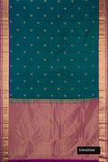 Peacock Blue Dual Tone Kanchipuram Silk Saree with Zari Butta on the body and Zari Border.  displayed on a mannequin
