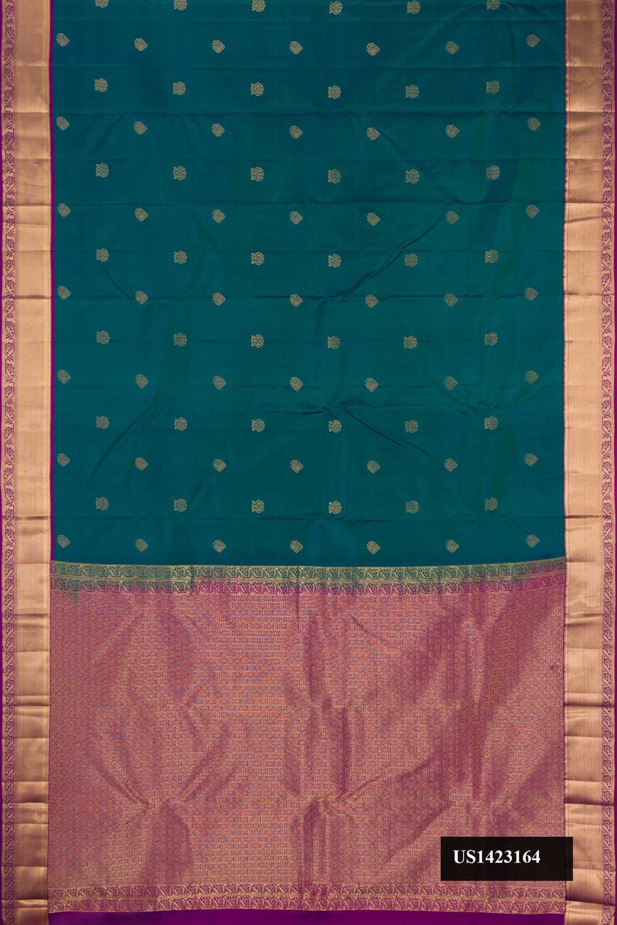 Peacock Blue Dual Tone Kanchipuram Silk Saree with Zari Butta on the body and Zari Border.  displayed on a mannequin