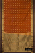 Brick Orange Dual Tone Kanchipuram Silk Saree with Zari Butta on the body and Zari Border.  displayed on a mannequin
