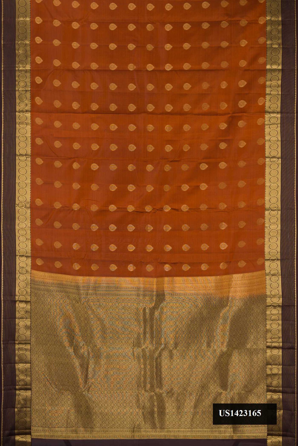 Brick Orange Dual Tone Kanchipuram Silk Saree with Zari Butta on the body and Zari Border.  displayed on a mannequin