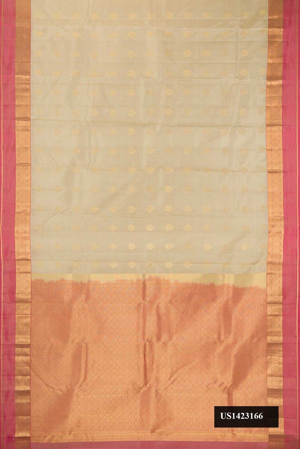 Beige Dual Tone Kanchipuram Silk Saree with Zari Butta on the body and Zari Border.  displayed on a mannequin