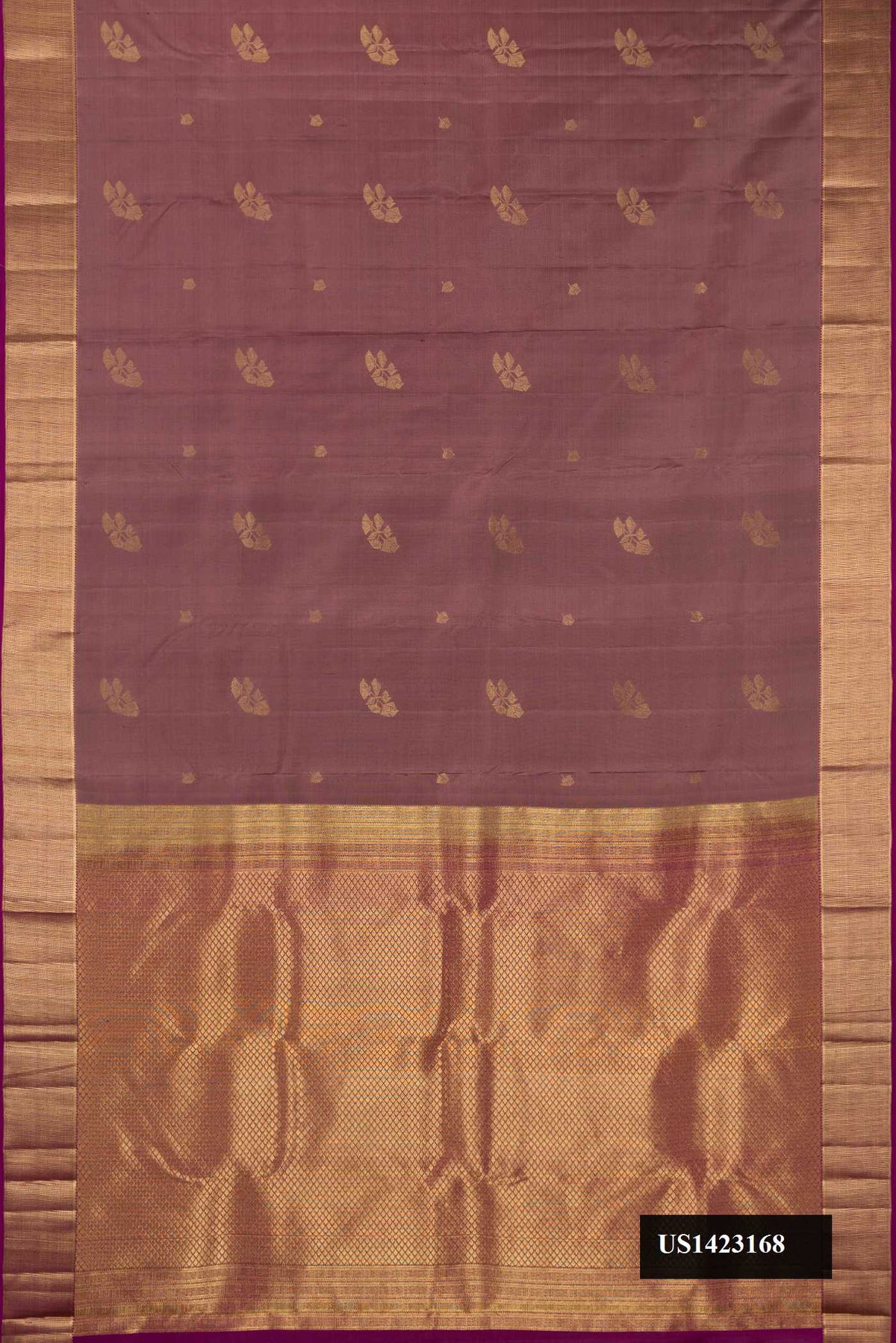 Brown Dual Tone Kanchipuram Silk Saree with Zari Butta on the body and Zari Border.  displayed on a mannequin