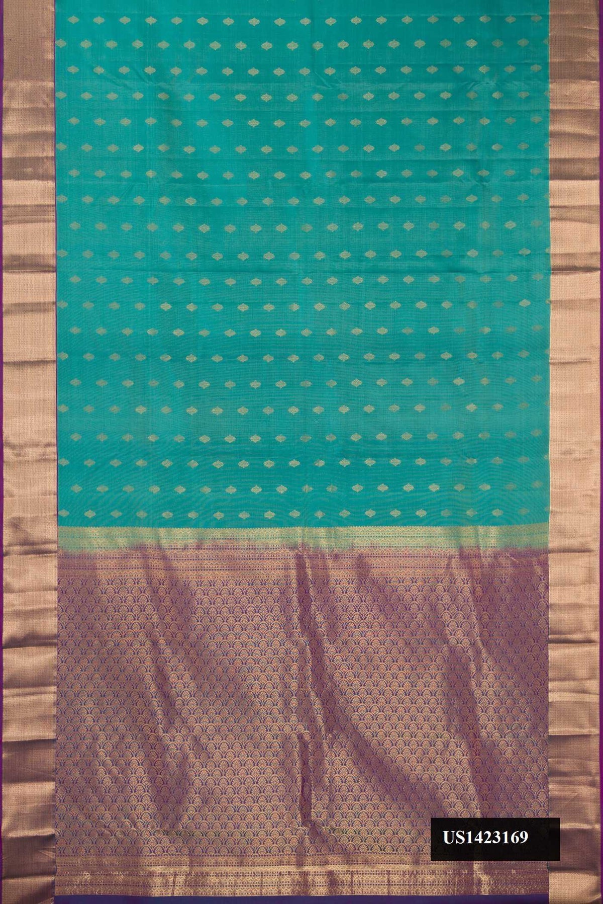 Green Dual Tone Kanchipuram Silk Saree with Zari Butta on the body and Zari Border.  displayed on a mannequin