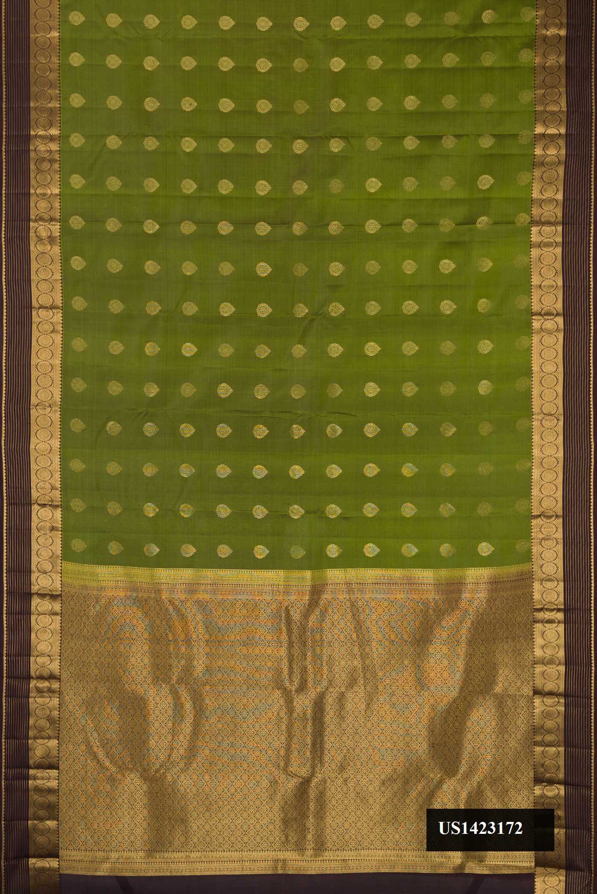 Mehandi Green Dual Tone Kanchipuram Silk Saree with Zari Butta on the body and Zari Border.  displayed on a mannequin
