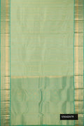Pista Green Dual Tone Kanchipuram Silk Saree with Zari Butta on the body and Zari Border.  displayed on a mannequin