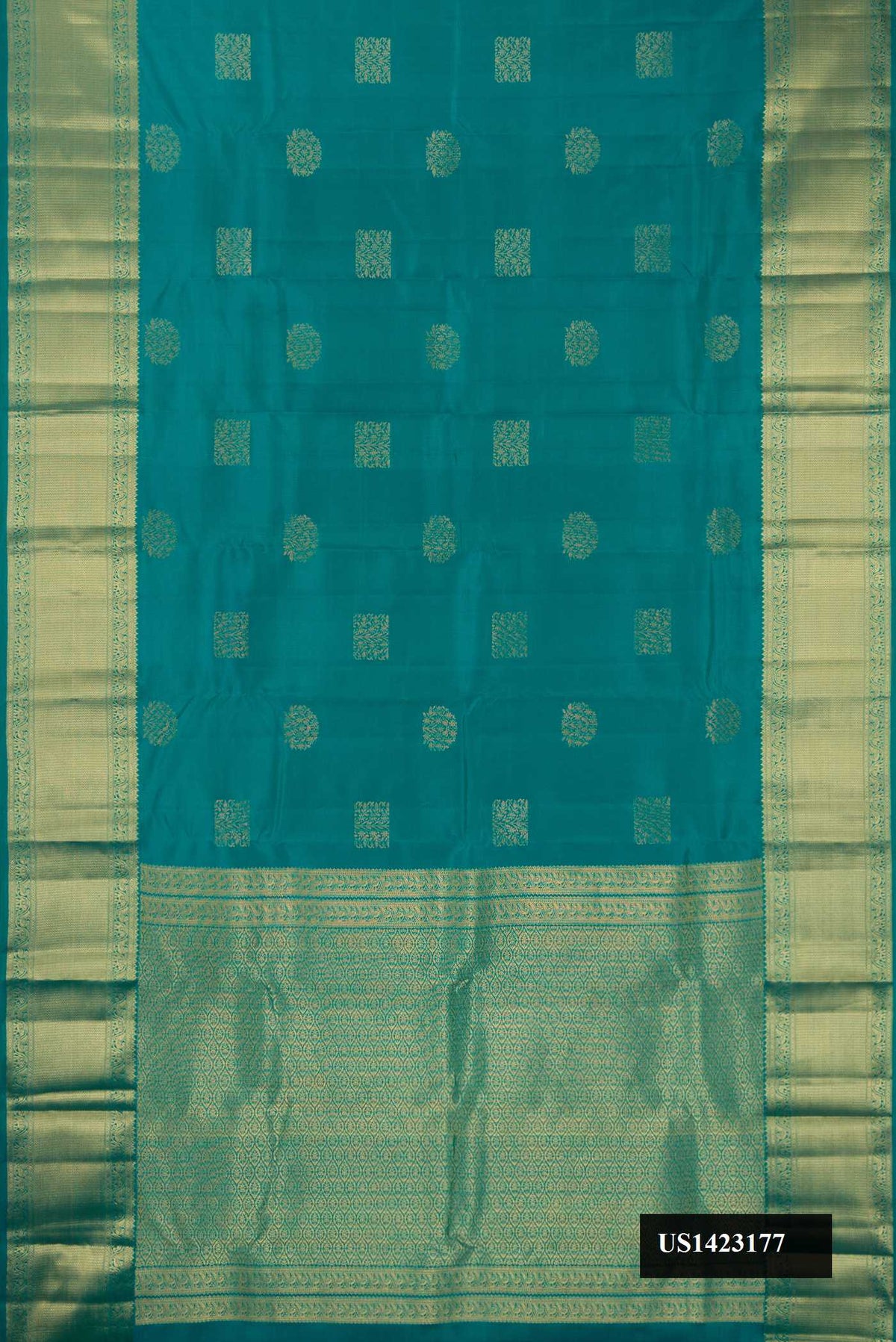 Green Dual Tone Kanchipuram Silk Saree with Zari Butta on the body and Zari Border.  displayed on a mannequin