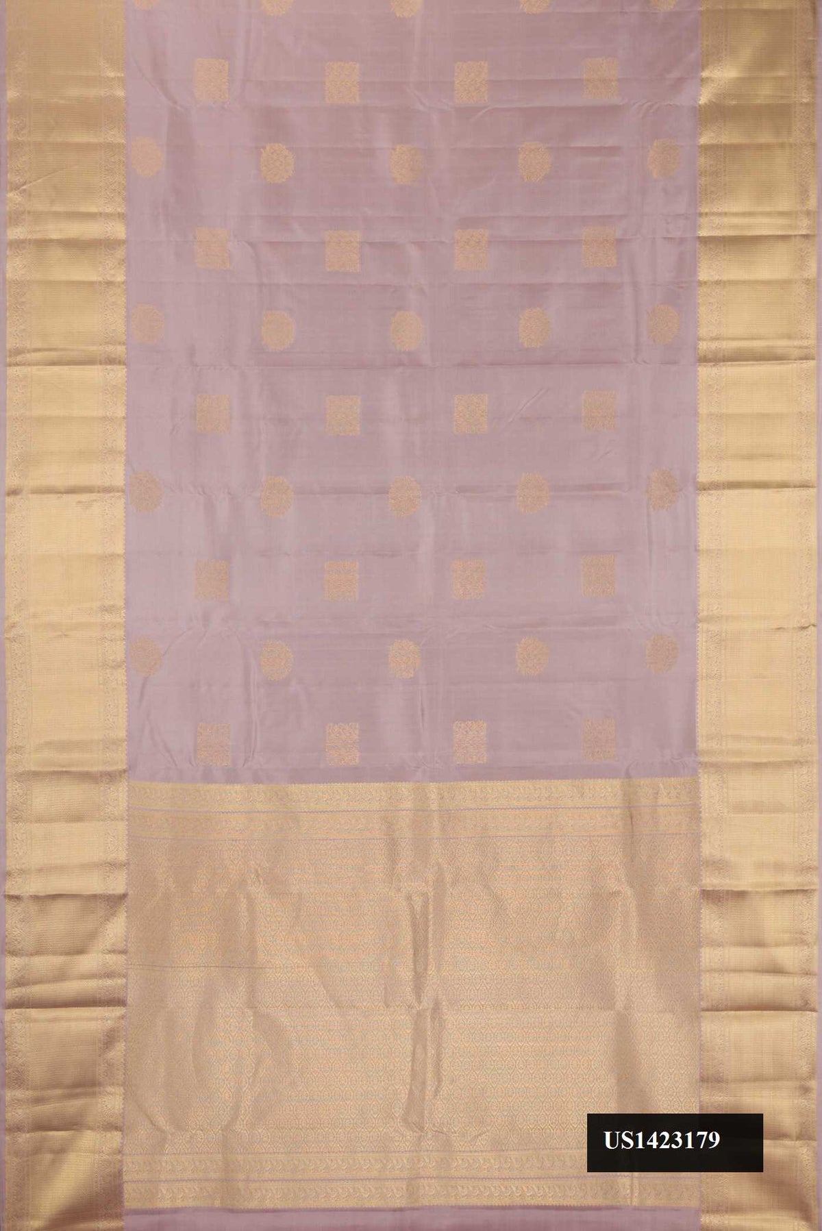 Rose Gold Dual Tone Kanchipuram Silk Saree with Zari Butta on the body and Zari Border.  displayed on a mannequin