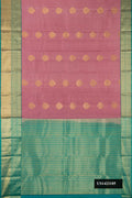 Rose Gold Dual Tone Kanchipuram Silk Saree with Zari Butta on the body and Zari Border.  displayed on a mannequin