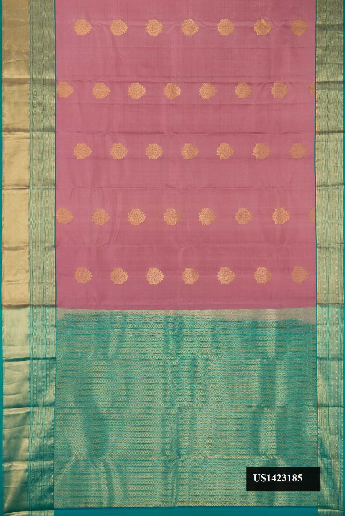 Rose Gold Dual Tone Kanchipuram Silk Saree with Zari Butta on the body and Zari Border.  displayed on a mannequin