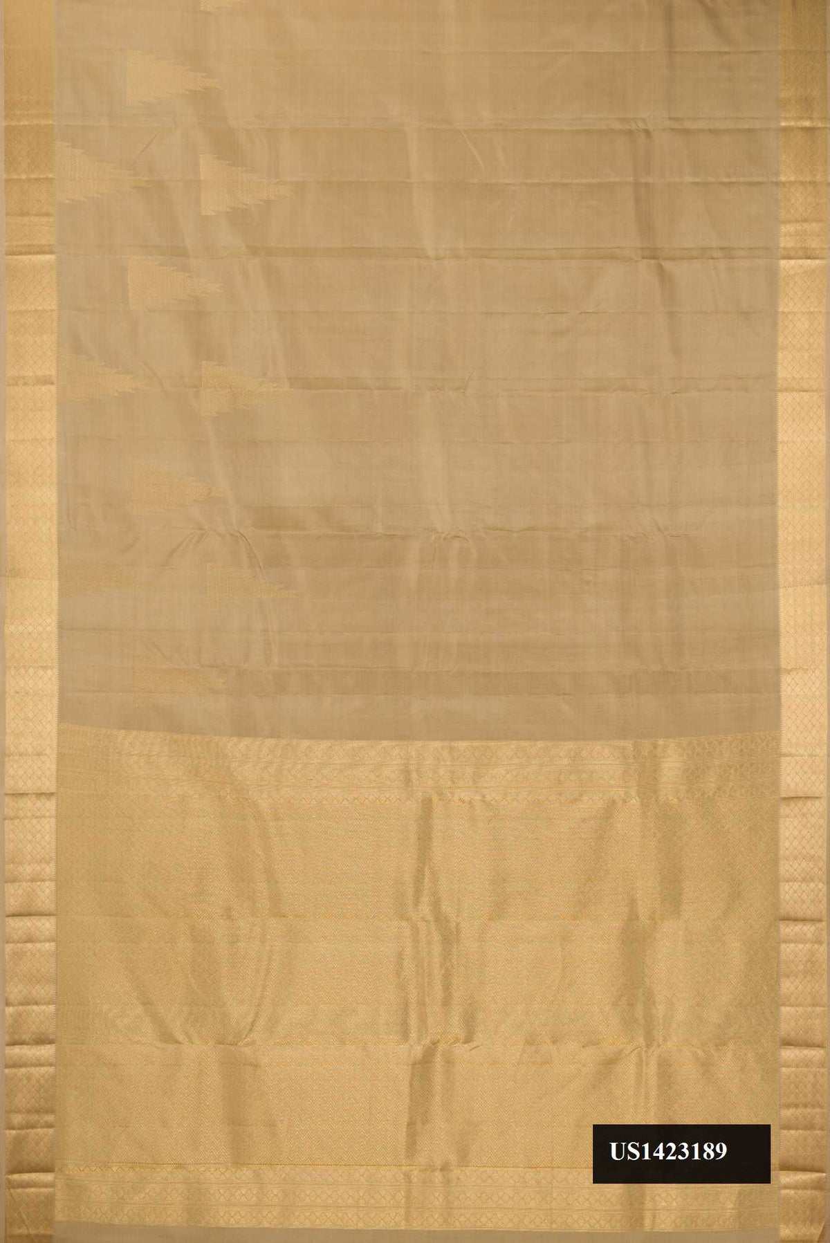 Dark Beige Dual Tone Kanchipuram Silk Saree with Zari Butta on the body and Zari Border.  displayed on a mannequin
