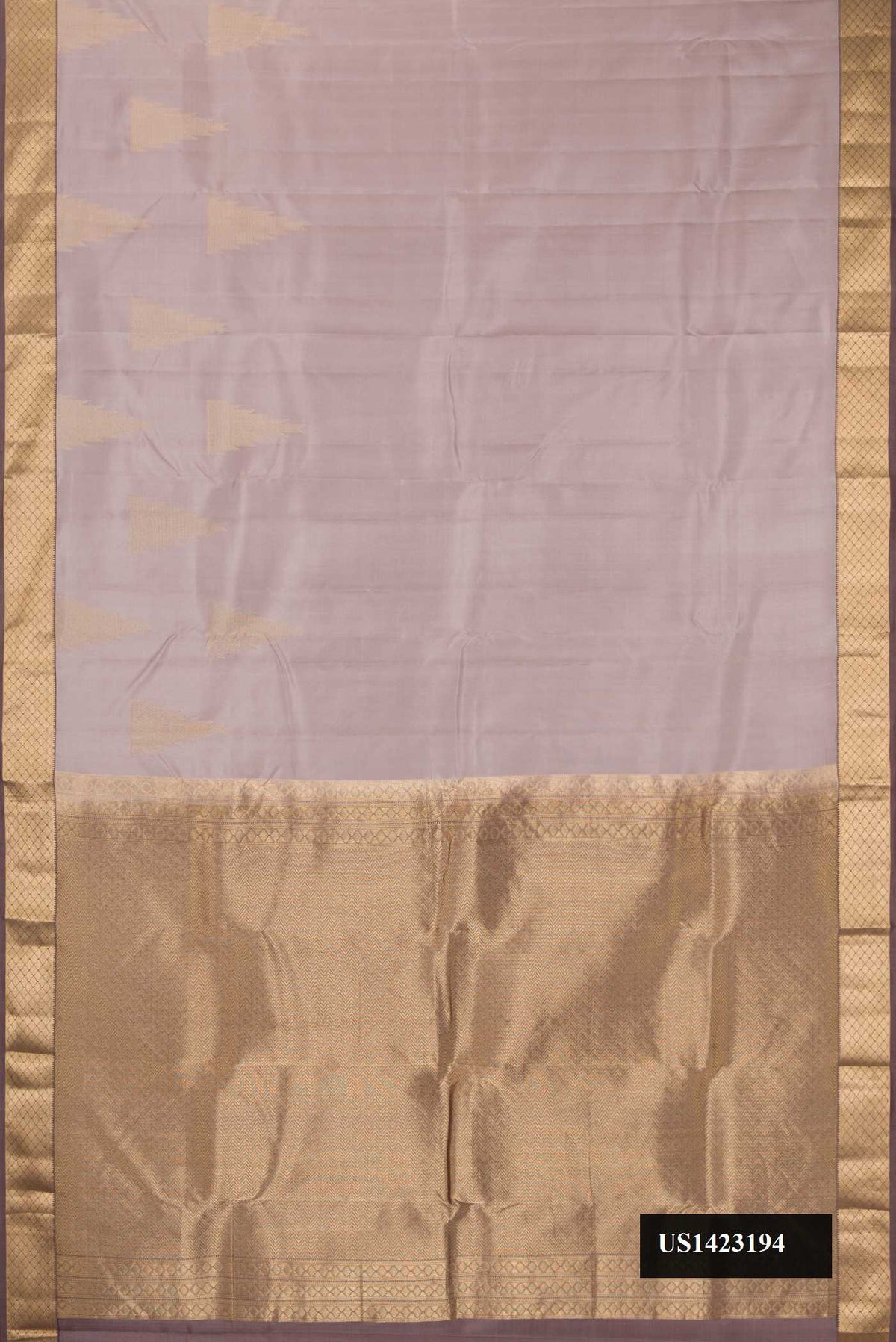 Rose Gold Dual Tone Kanchipuram Silk Saree with Zari Butta on the body and Zari Border.  displayed on a mannequin