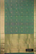 Green Dual Tone Kanchipuram Silk Saree with Stripes on the body and Zari Border.  displayed on a mannequin