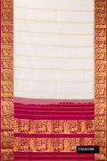 Off White Dual Tone Kanchipuram Silk Saree with Stripes on the body and Zari Border.  displayed on a mannequin
