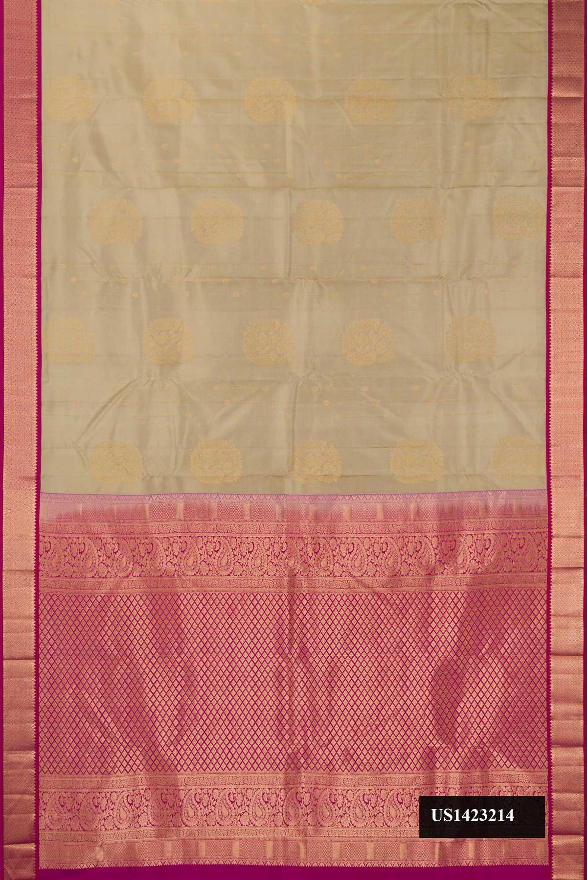 Beige Dual Tone Kanchipuram Silk Saree with Zari Butta on the body and Zari Border.  displayed on a mannequin