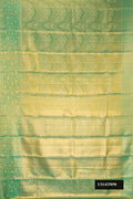 Green Dual Tone Kanchipuram Tissue Silk Saree with Zari Brocade on the body and Zari Border.  displayed on a mannequin