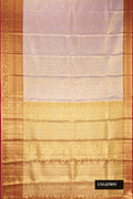 Lavender Dual Tone Kanchipuram Tissue Silk Saree with Zari Brocade on the body and Zari Border.  displayed on a mannequin