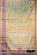 Green Dual Tone Kanchipuram Tissue Silk Saree with Zari Brocade on the body and Fancy Border.  displayed on a mannequin