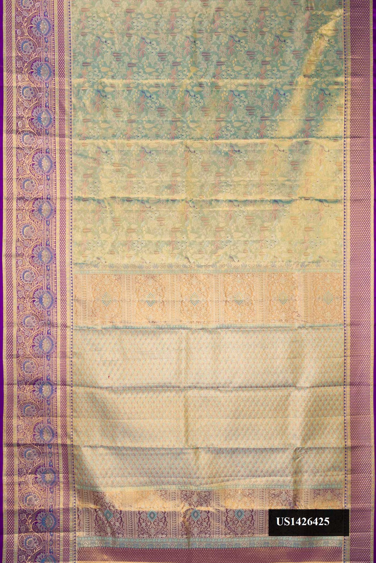 Green Dual Tone Kanchipuram Tissue Silk Saree with Zari Brocade on the body and Fancy Border.  displayed on a mannequin