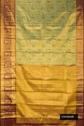 Parrot Green Dual Tone Kanchipuram Tissue Silk Saree with Zari Brocade on the body and Fancy Border.  displayed on a mannequin