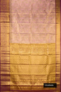 Rose Gold Dual Tone Kanchipuram Tissue Silk Saree with Zari Brocade on the body and Zari Border.  displayed on a mannequin