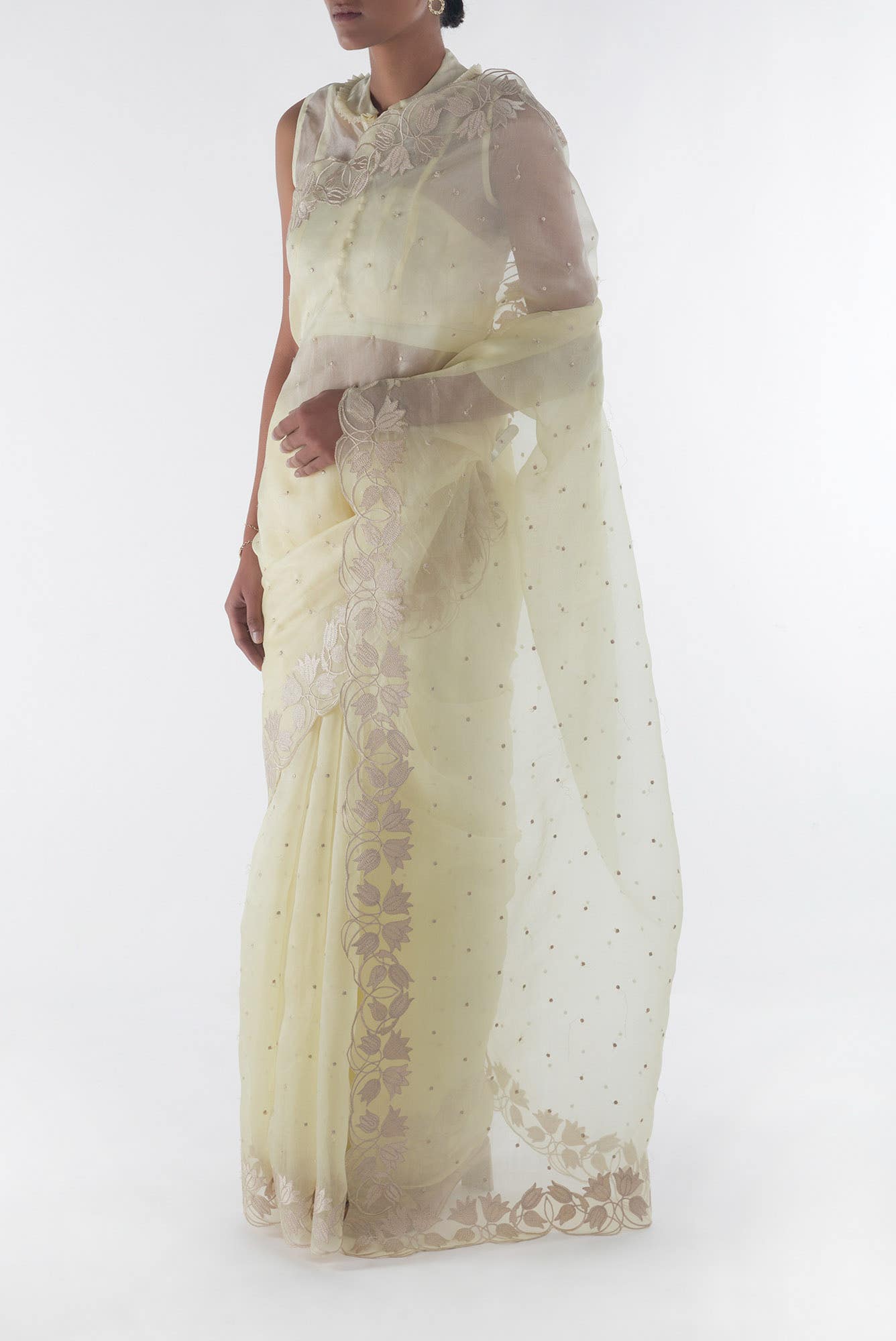Piety of a Lili Cream floral design saree from Embroidered Romance Collection by Nalli