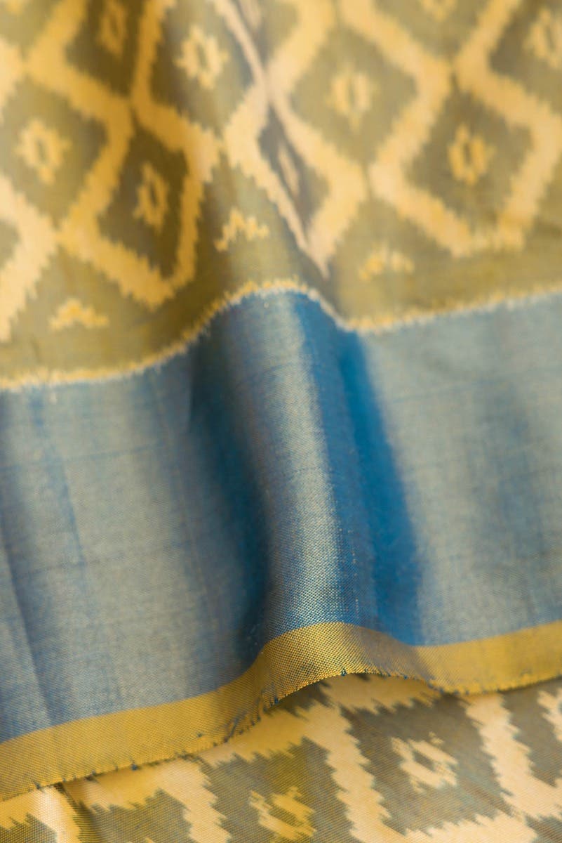 Green and Blue Dual Tone Raw Silk Saree