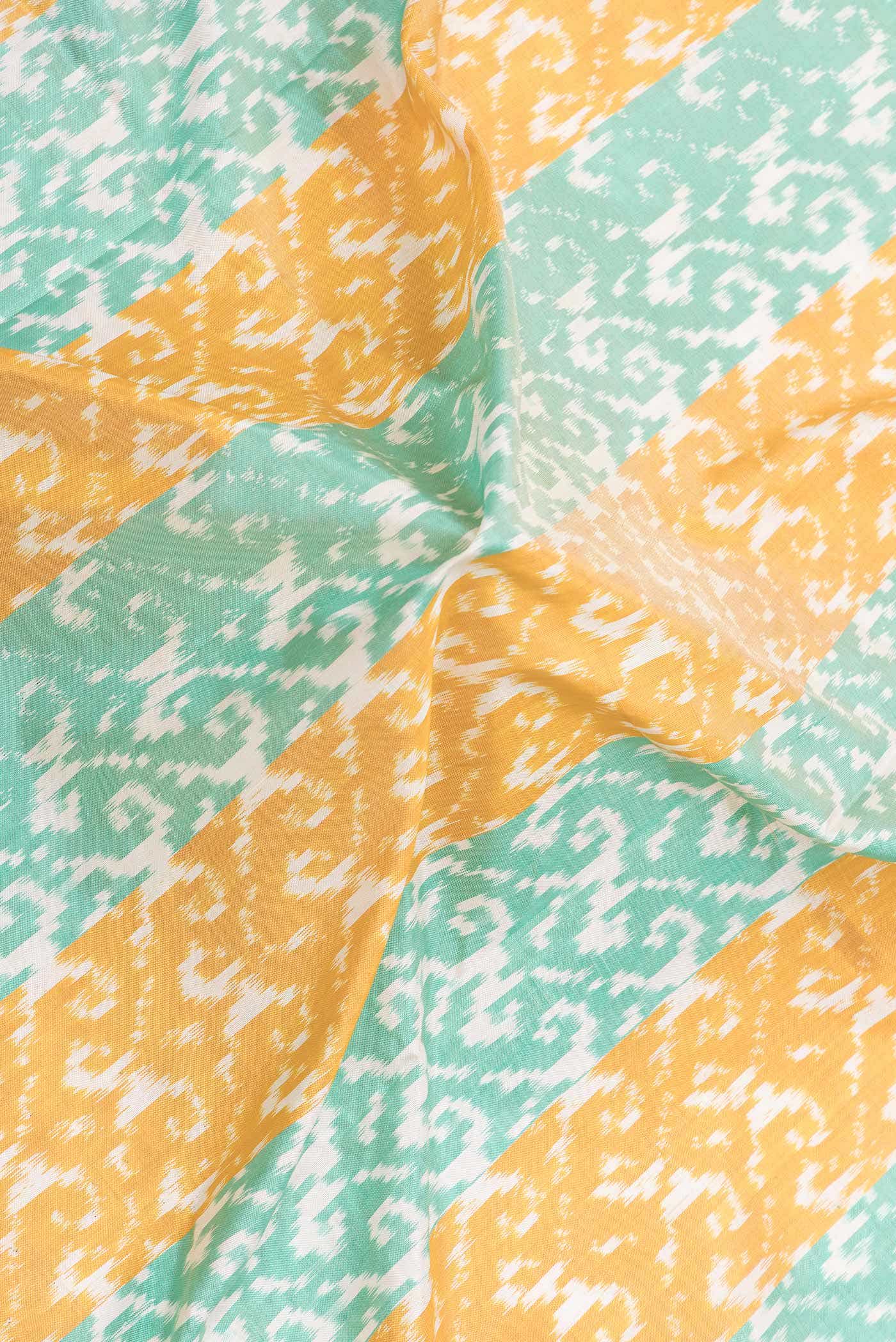 Mustard and Sea Green Dual Tone Double Ikat Saree